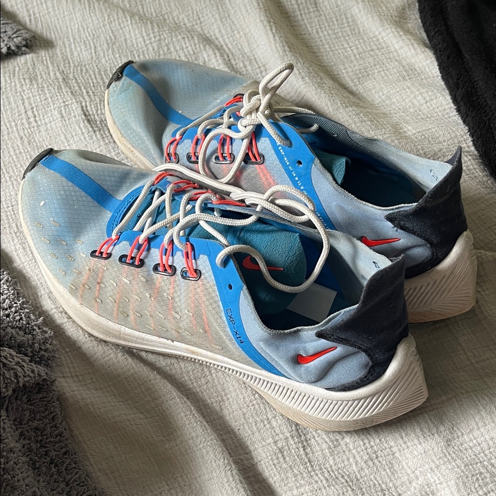 Nike Blue and White Running Shoes with Red Accents